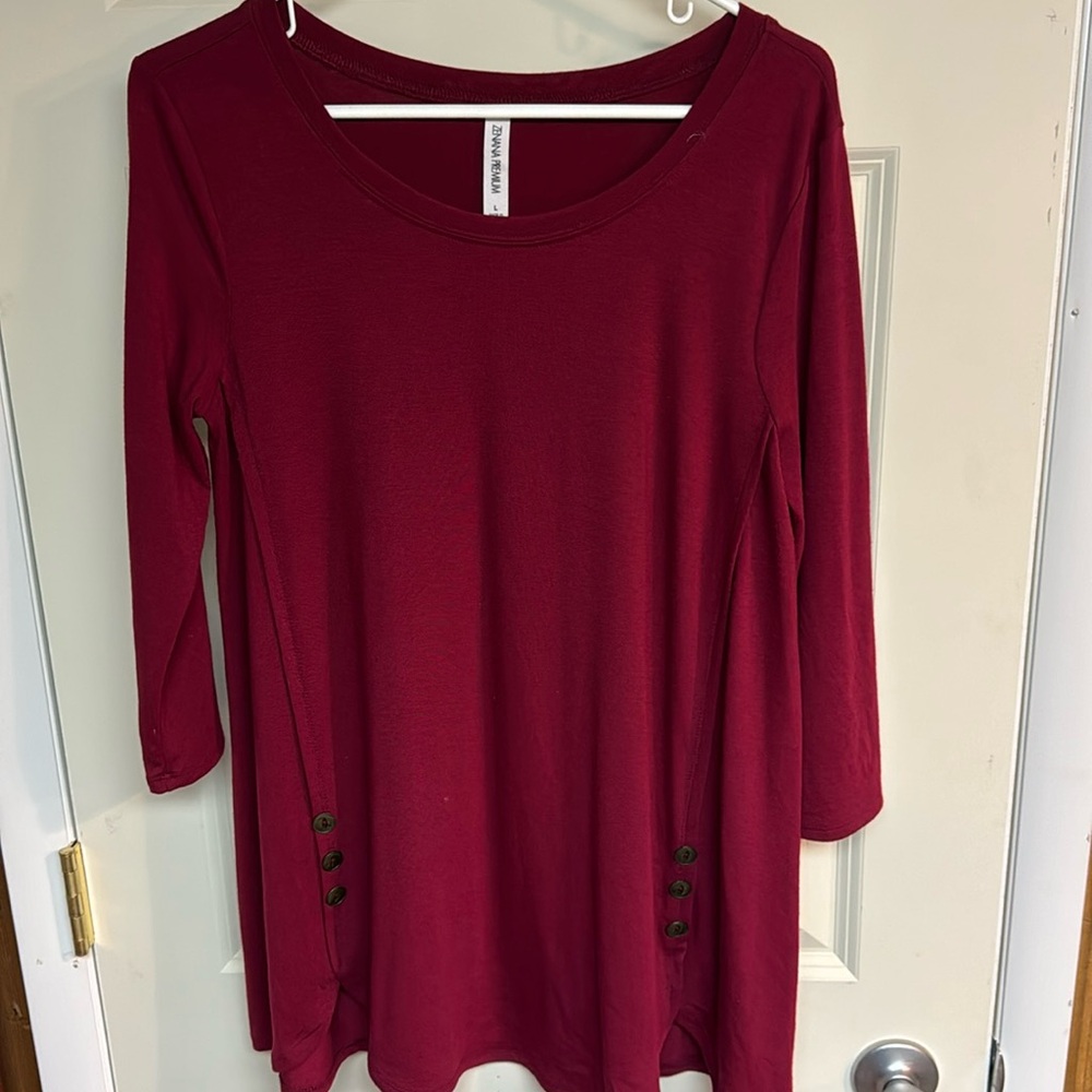 Maroon shirt with buttons down the side